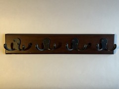 Contemporary multi hook coat and hat rack dark brown finish, matte black hooks
